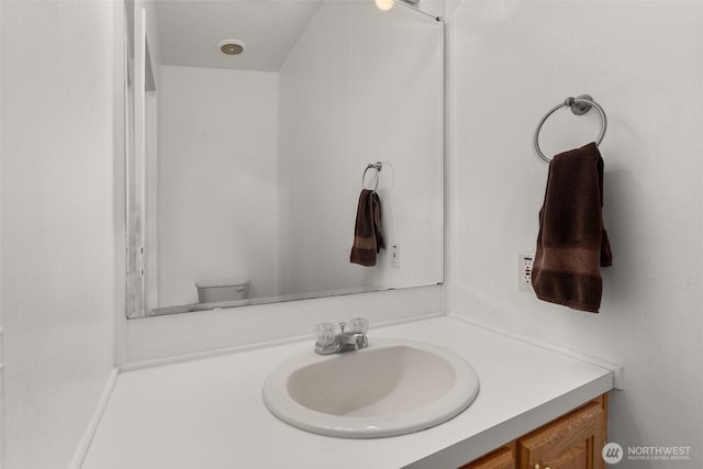 bathroom with toilet and vanity