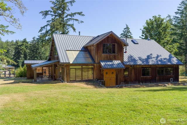 631 Cousins Rd, Lopez Island, WA 98261 - view of front of home featuring a standing seam roof, a front yard, and metal roof