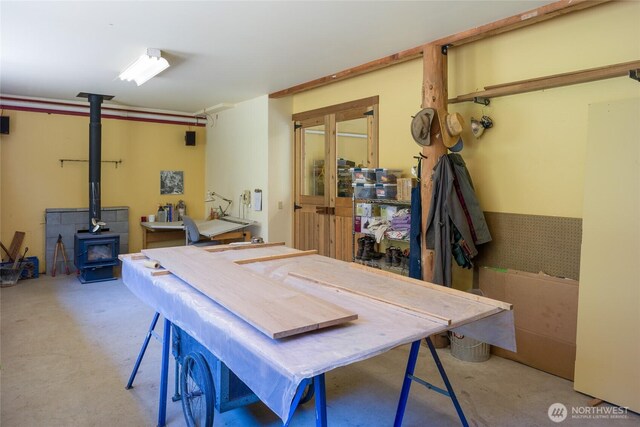 631 Cousins Rd, Lopez Island, WA 98261 - interior space featuring a workshop area and a wood stove