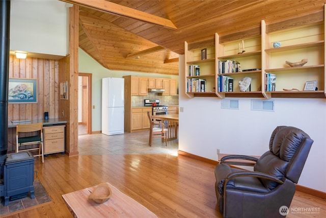 631 Cousins Rd, Lopez Island, WA 98261 - sitting room with a wood stove, wood ceiling, wood walls, and light wood finished floors