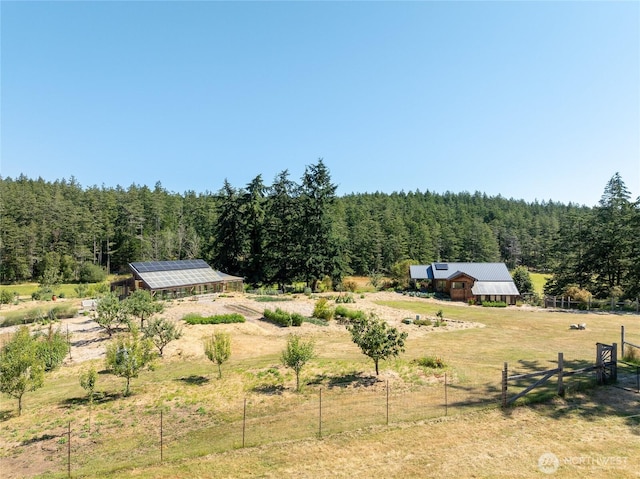 631 Cousins Rd, Lopez Island, WA 98261 - view of yard with a rural view, an outdoor structure, fence, and a view of trees