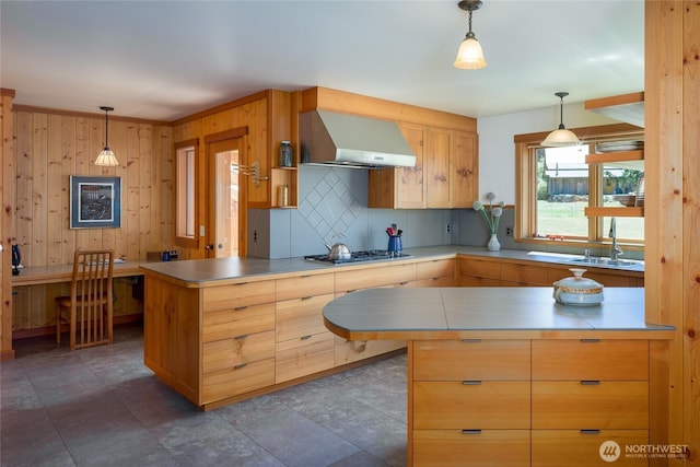 631 Cousins Rd, Lopez Island, WA 98261 - kitchen with a peninsula, wall chimney exhaust hood, tasteful backsplash, and stainless steel gas cooktop