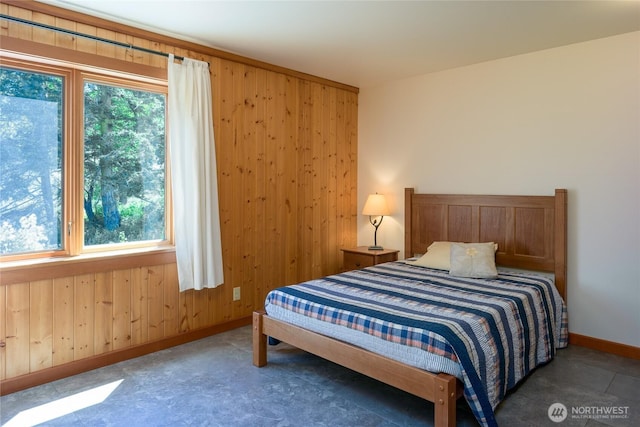 631 Cousins Rd, Lopez Island, WA 98261 - bedroom featuring baseboards and wooden walls