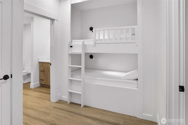 bedroom with wood finished floors
