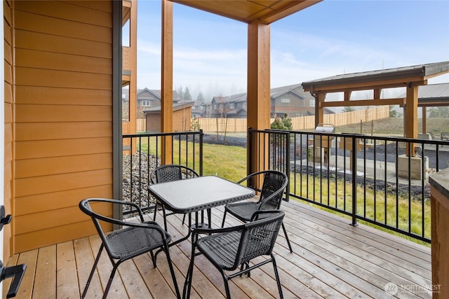 deck with fence and a residential view