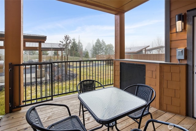 balcony featuring outdoor dining space