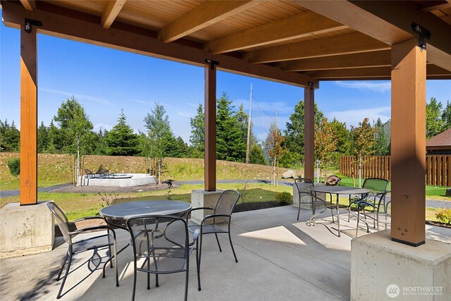 view of patio / terrace with outdoor dining space and fence