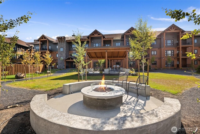view of patio / terrace with fence and an outdoor fire pit