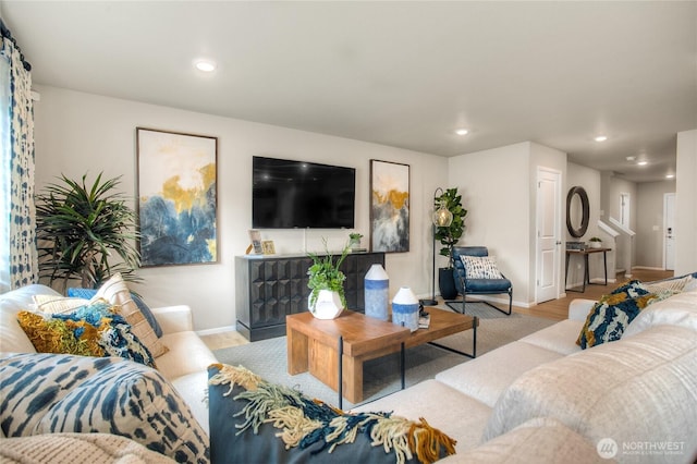 living area featuring recessed lighting, baseboards, and wood finished floors