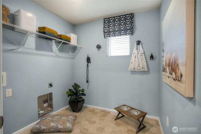 washroom featuring laundry area, baseboards, and hookup for an electric dryer