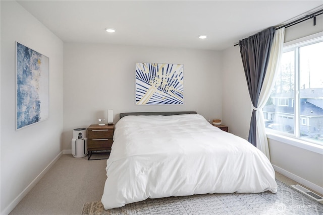 bedroom with visible vents, light carpet, baseboards, and recessed lighting