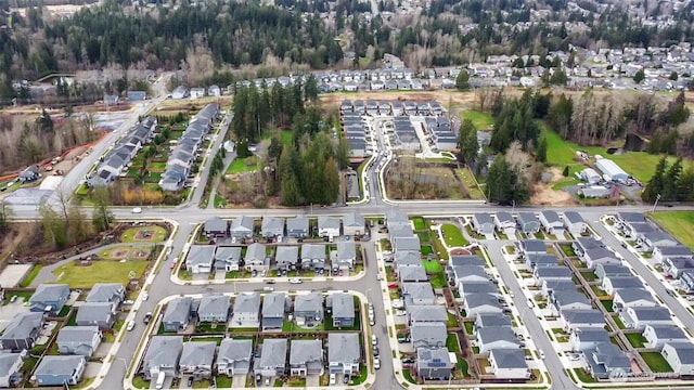 birds eye view of property with a residential view