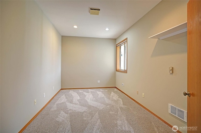 carpeted empty room featuring visible vents, recessed lighting, and baseboards