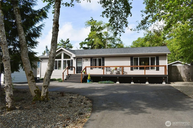 671 Duck Lake Dr SE, Ocean Shores, WA 98569 - view of front of house with a wooden deck