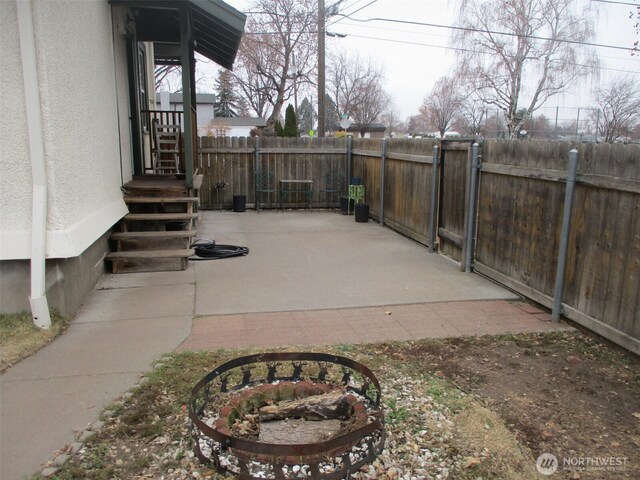 view of patio featuring a gate and fence