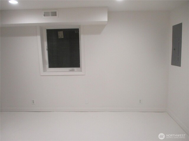 empty room featuring electric panel, recessed lighting, and visible vents