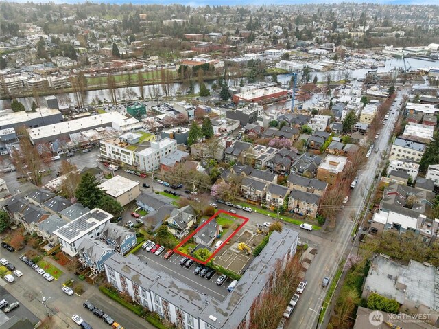 birds eye view of property with a water view