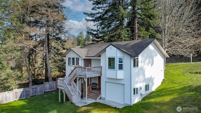 4195 Windy Cove Ln, Clinton, WA 98236 - rear view of house with a yard, stairs, a garage, and fence