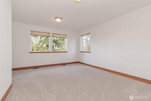 4195 Windy Cove Ln, Clinton, WA 98236 - spare room with visible vents, baseboards, and carpet