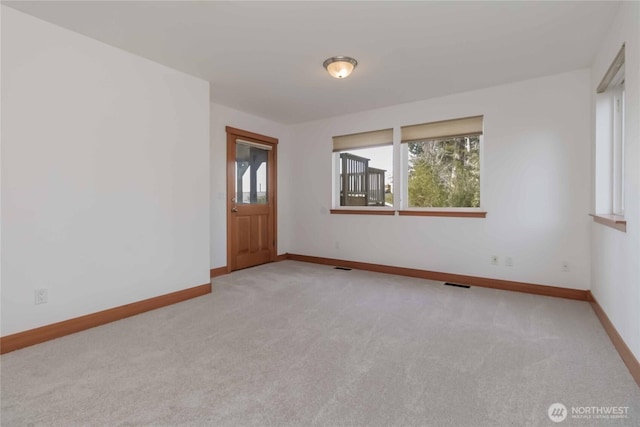 4195 Windy Cove Ln, Clinton, WA 98236 - spare room featuring light carpet, visible vents, and baseboards