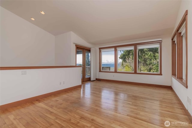 4195 Windy Cove Ln, Clinton, WA 98236 - unfurnished room with recessed lighting, light wood-style flooring, baseboards, and vaulted ceiling