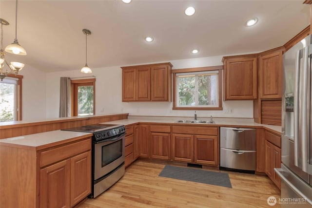 4195 Windy Cove Ln, Clinton, WA 98236 - kitchen featuring plenty of natural light, a peninsula, stainless steel appliances, and a sink