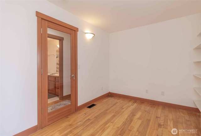 4195 Windy Cove Ln, Clinton, WA 98236 - unfurnished room with light wood finished floors, visible vents, and baseboards