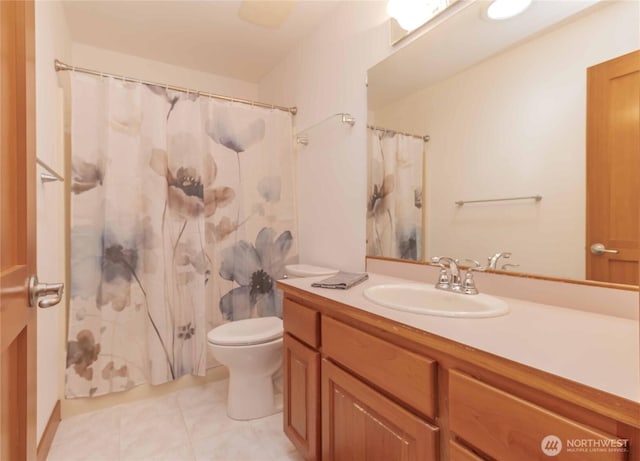 4195 Windy Cove Ln, Clinton, WA 98236 - full bath with vanity, curtained shower, toilet, and tile patterned flooring