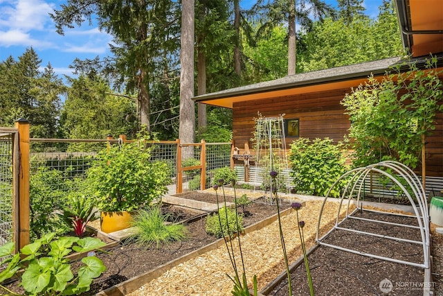 11012 Skinner Rd NE, Bainbridge Island, WA 98110 - view of yard featuring a vegetable garden and fence
