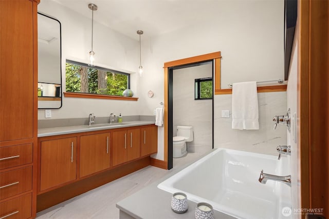 11012 Skinner Rd NE, Bainbridge Island, WA 98110 - full bathroom with toilet, vanity, and a tub to relax in