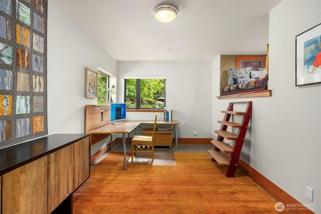 11012 Skinner Rd NE, Bainbridge Island, WA 98110 - home office featuring baseboards and wood finished floors