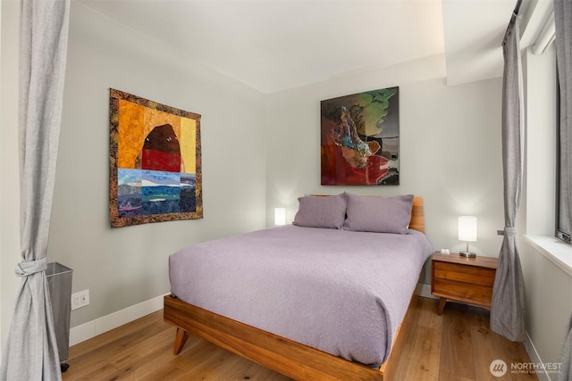 11012 Skinner Rd NE, Bainbridge Island, WA 98110 - bedroom with wood finished floors and baseboards