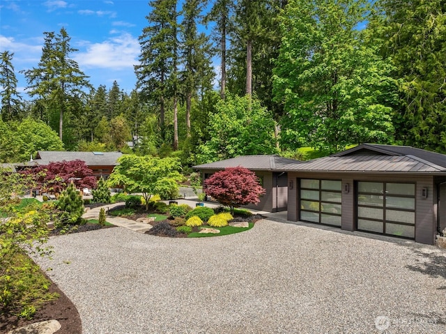 11012 Skinner Rd NE, Bainbridge Island, WA 98110 - view of yard featuring driveway and a garage