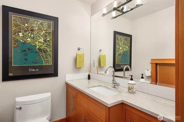11012 Skinner Rd NE, Bainbridge Island, WA 98110 - half bathroom featuring toilet and vanity