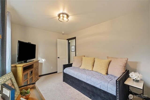 living area with baseboards and carpet floors