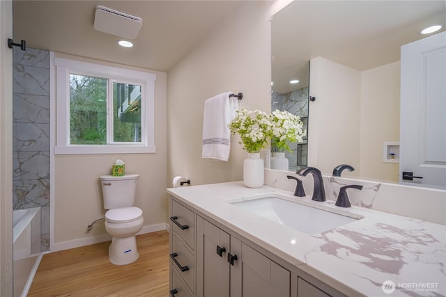bathroom with wood finished floors, toilet, baseboards, vanity, and recessed lighting