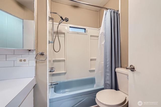 bathroom with vanity, toilet, and shower / bath combo with shower curtain