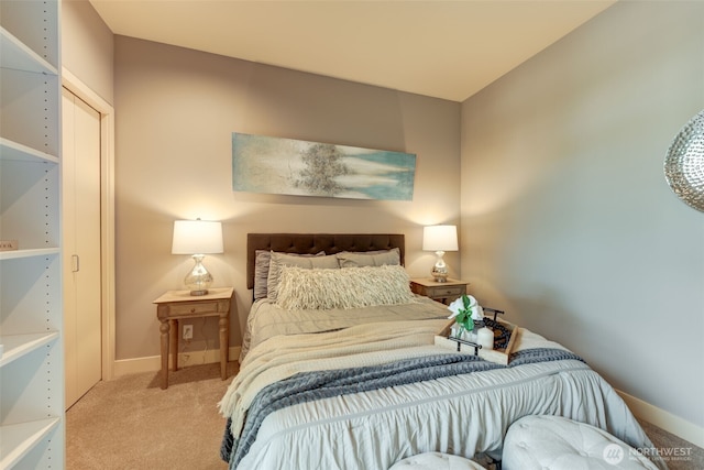 bedroom with baseboards and carpet floors