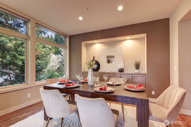 dining area with recessed lighting, baseboards, and light wood-style flooring