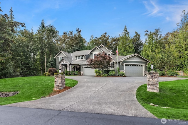 view of front of house featuring a front lawn, concrete driveway, and a garage