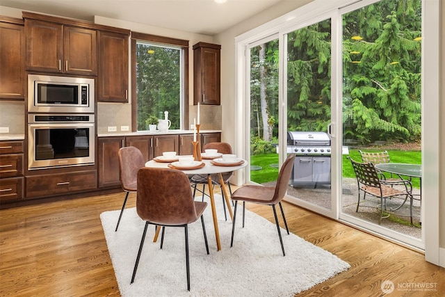 dining area with light wood-style flooring