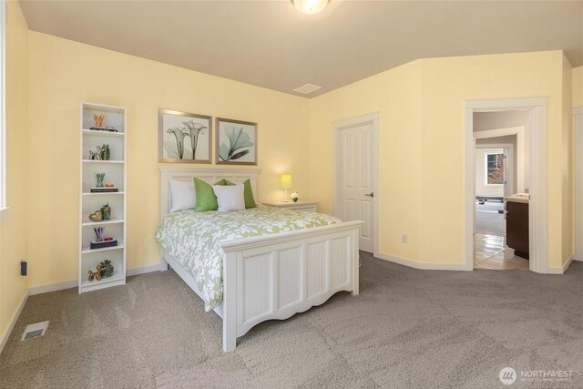 bedroom featuring baseboards, visible vents, and carpet floors