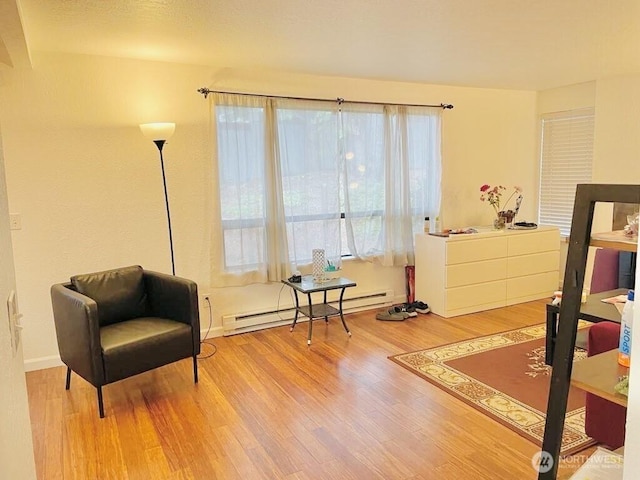 705 NE 143rd Ave Unit A1, Bellevue, WA 98007 - bedroom with a baseboard radiator and wood finished floors