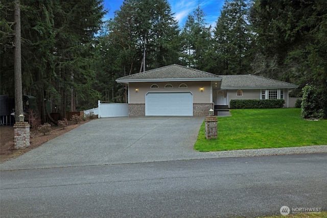 view of front of property with a front lawn, driveway, an attached garage, and a tiled roof