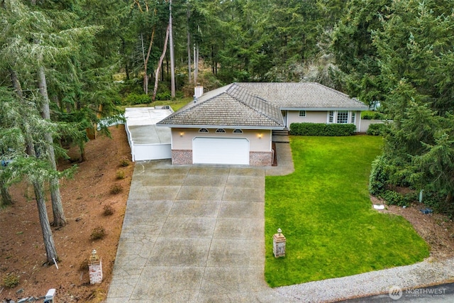 single story home featuring driveway, an attached garage, a tile roof, and a front yard