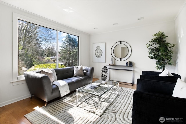 4712 S Angeline St, Seattle, WA 98118 - living area featuring crown molding, baseboards, and wood finished floors