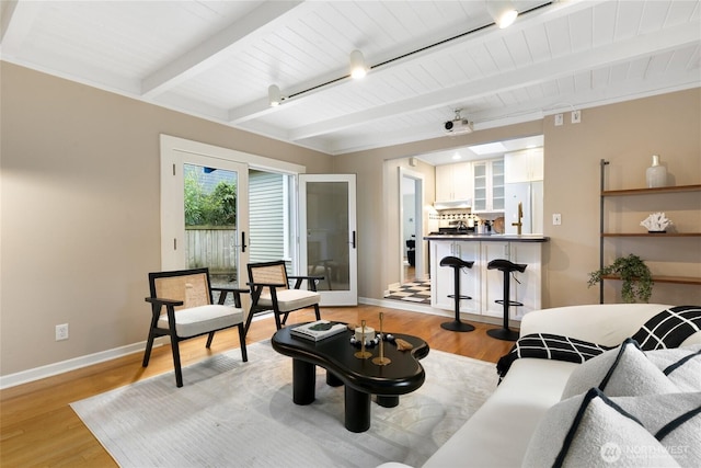 4712 S Angeline St, Seattle, WA 98118 - living room featuring wooden ceiling, beamed ceiling, baseboards, and light wood-type flooring