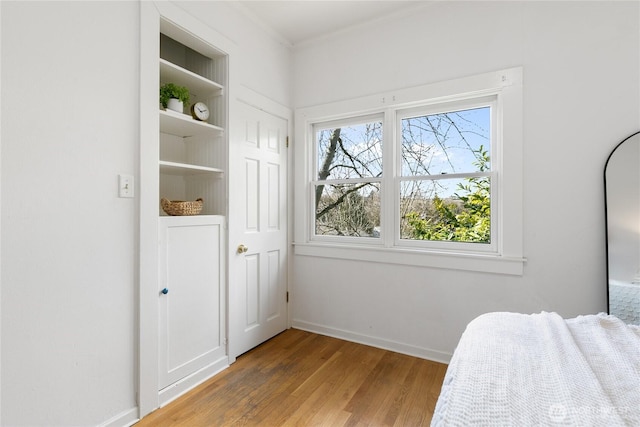 4712 S Angeline St, Seattle, WA 98118 - bedroom featuring wood finished floors, baseboards, and ornamental molding
