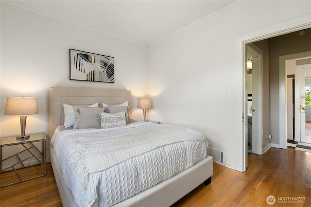 4712 S Angeline St, Seattle, WA 98118 - bedroom featuring visible vents, baseboards, and wood finished floors