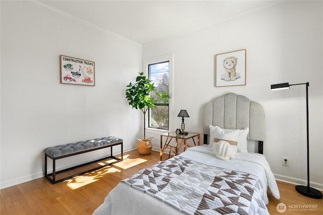 4712 S Angeline St, Seattle, WA 98118 - bedroom featuring wood finished floors, baseboards, and ornamental molding